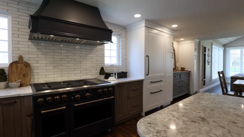 Ceramic tile backsplash installation adding visual interest and wall protection in a kitchen remodel
