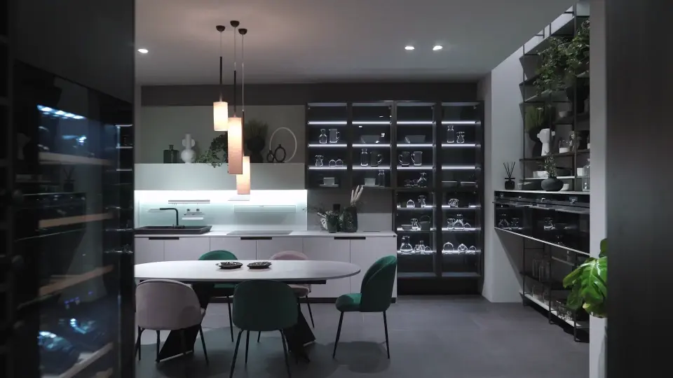 Luxury kitchen remodel featuring custom cabinetry, large island, premium countertops, and designer lighting